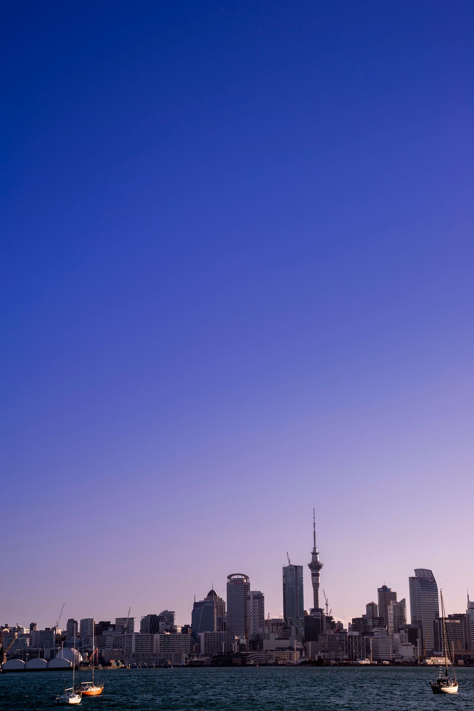 Auckland’s skyline across the harbour at sunset