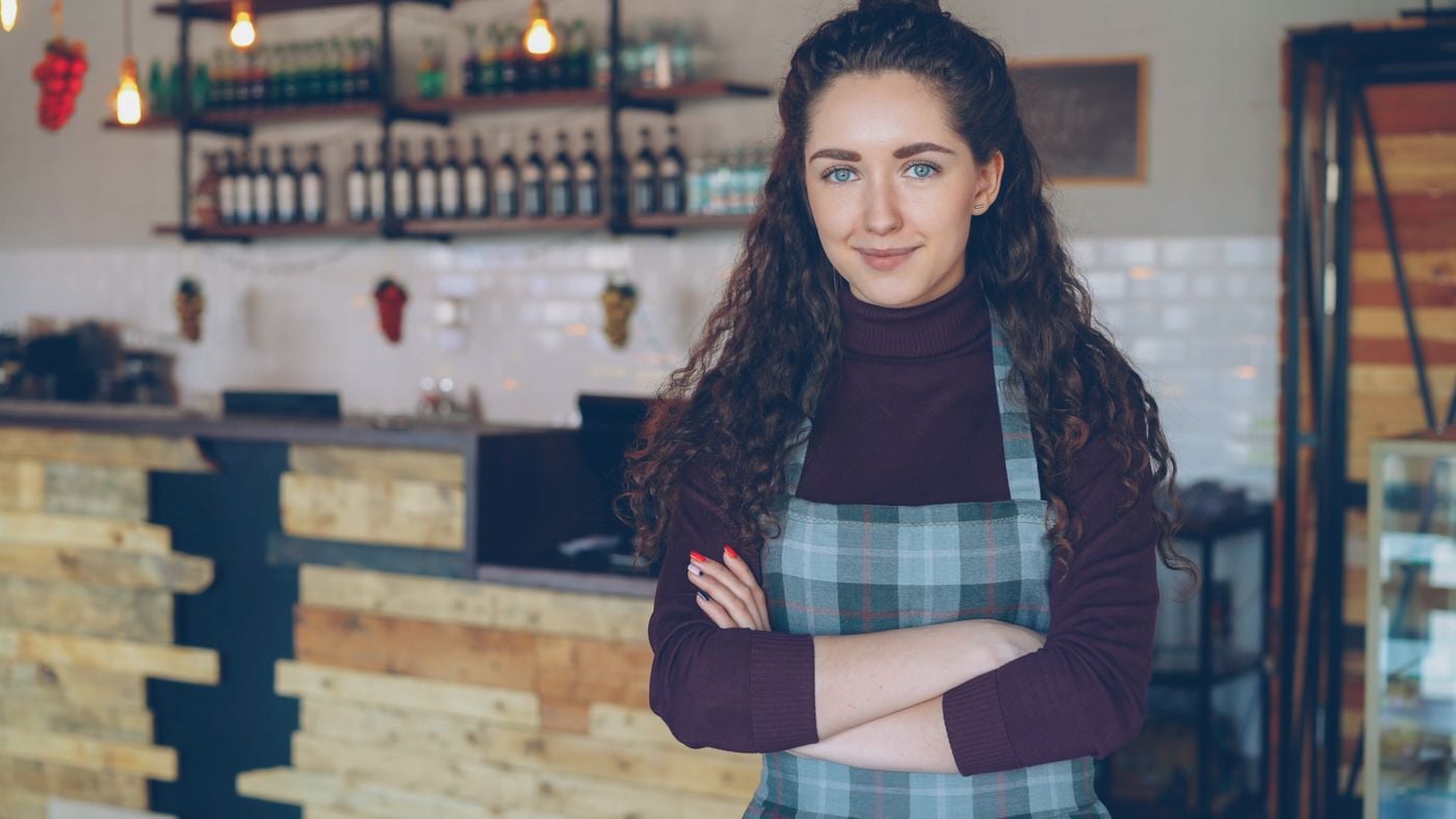 A business owner in a welcoming neighbourhood café