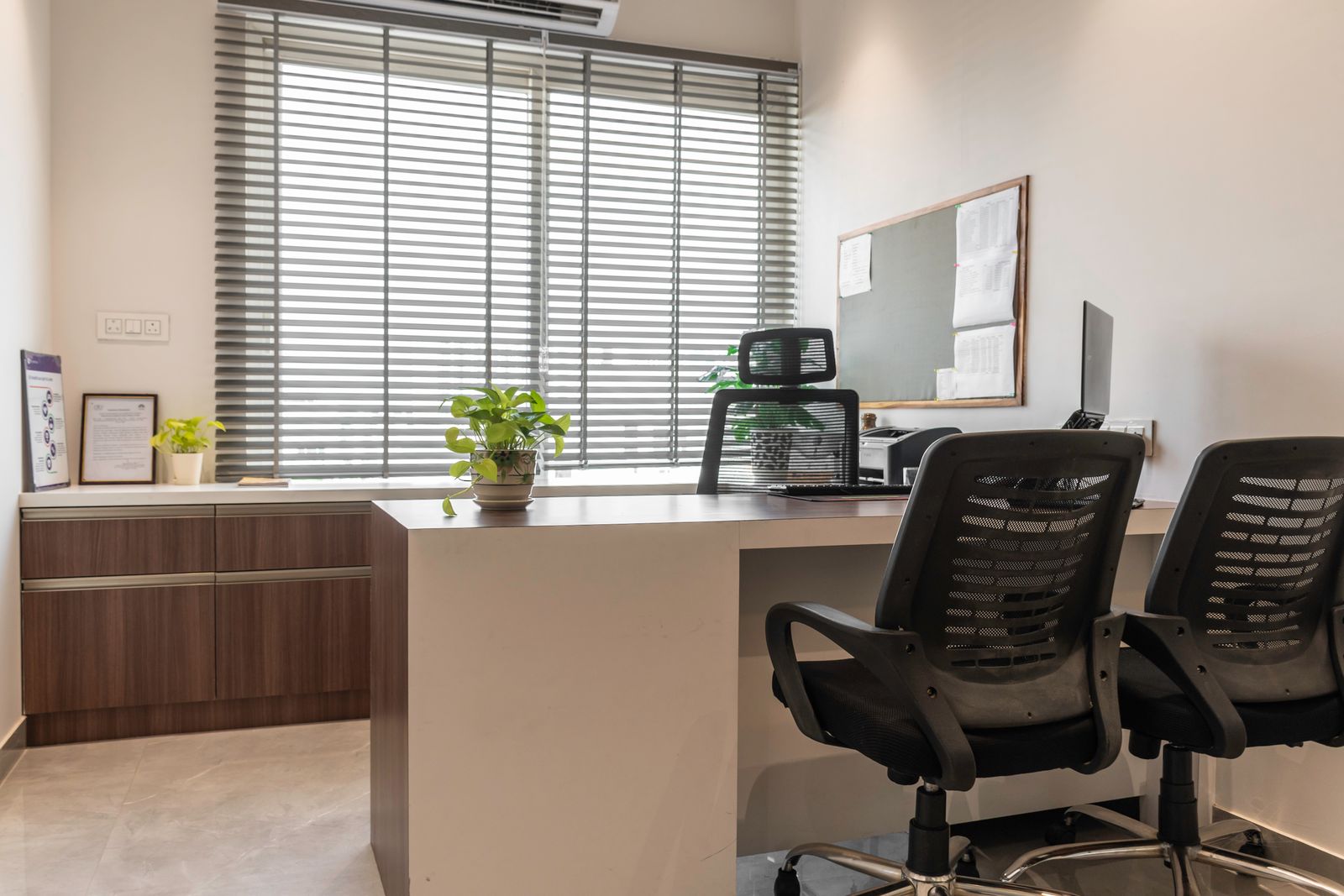 A bright contemporary workspace with natural light and warm furnishings